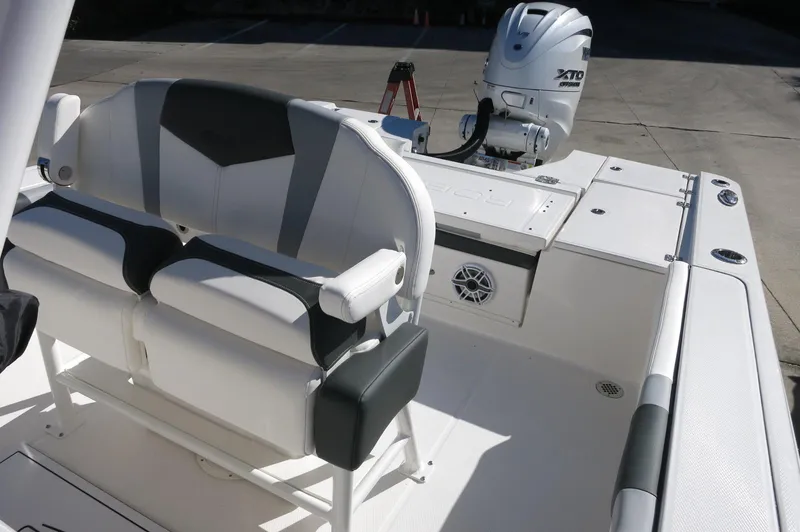 Slide: The Image of 2025 Robalo 266 Cayman boat interior with seating and outboard motor. - 30