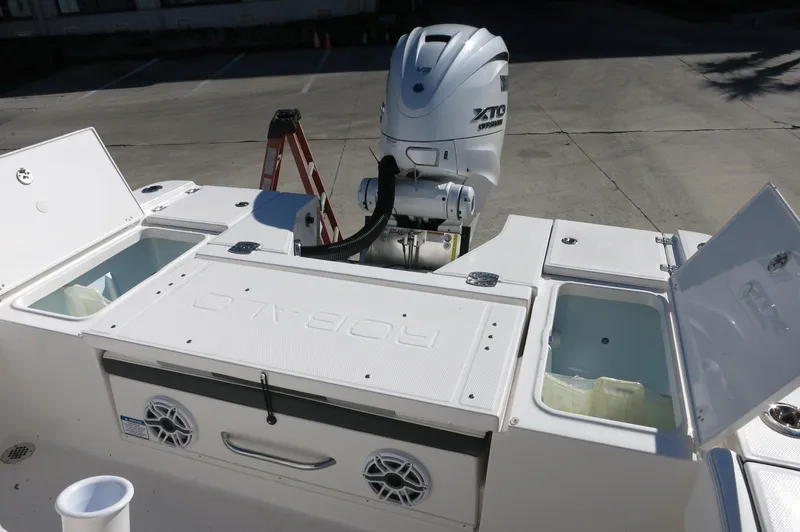 Slide: The Image of 2025 Robalo 266 Cayman boat with Yamaha XTO outboard engine and storage compartments. - 34