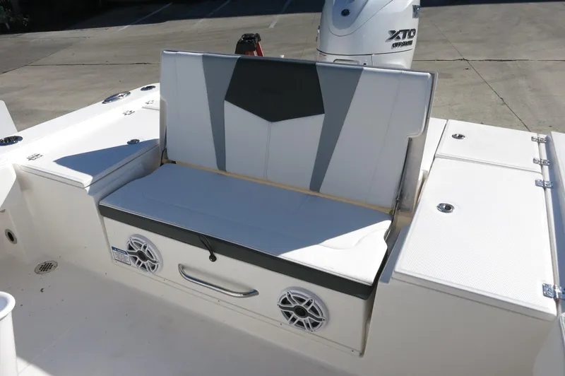 Slide: The Image of 2025 Robalo 266 Cayman boat seating with integrated speakers and storage. - 39