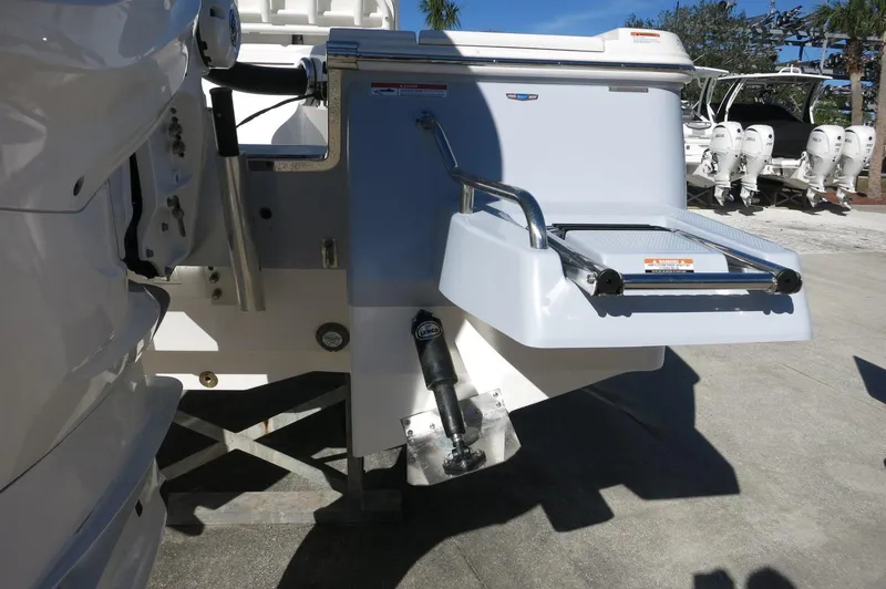 Slide: The Image of 2025 Robalo 266 Cayman boat stern with swim platform and ladder. - 8