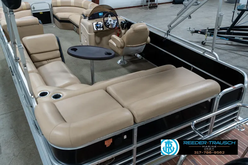 Slide: The Image of 2014 Bennington 522CR pontoon boat with beige seating and modern dashboard. - 15