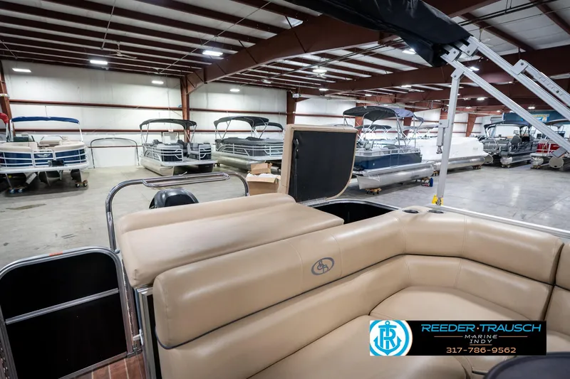Slide: The Image of 2014 Bennington 522CR pontoon boat in showroom with other boats. - 33