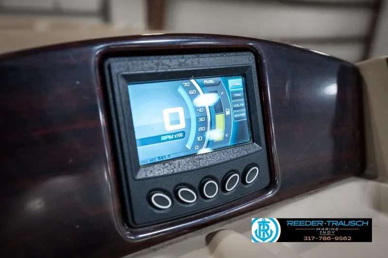 Slide: The Image of Dashboard of a 2014 Bennington 522CR boat with digital display and controls. - 38