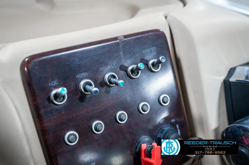 Slide: The Image of Control panel of a 2014 Bennington 522CR boat with labeled switches. - 40