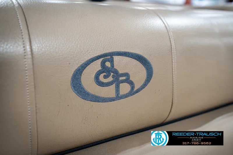 Slide: The Image of Beige leather seat with embroidered logo on a 2014 Bennington 522CR boat. - 44