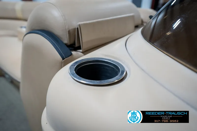 Slide: The Image of Beige interior of 2014 Bennington 522CR boat with cup holder detail. - 46