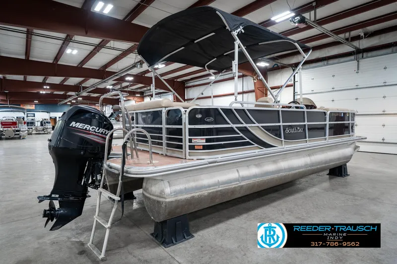 Slide: The Image of 2014 Bennington 522CR pontoon boat with Mercury outboard engine in indoor showroom. - 8