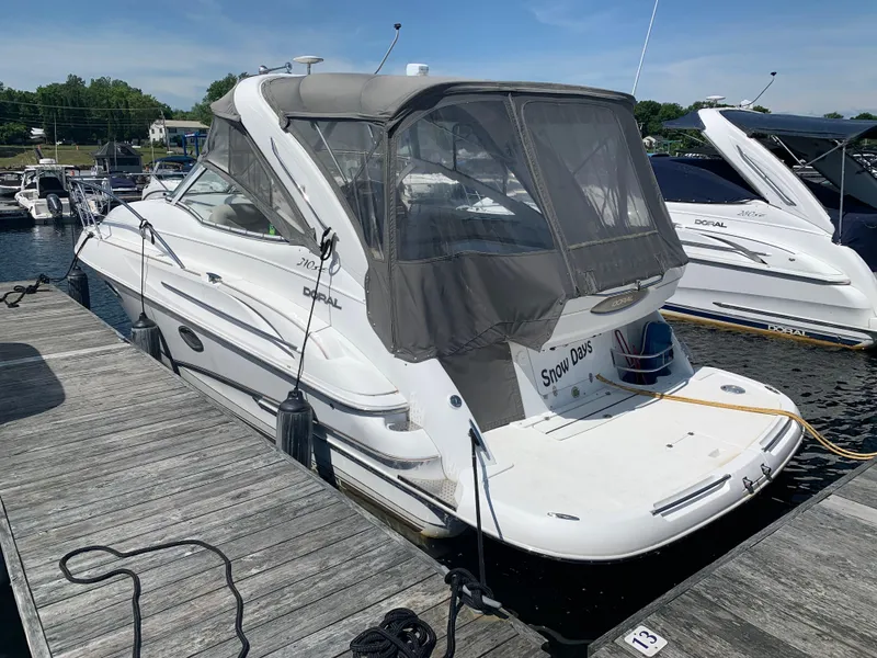 Slide: The Image of 2002 Doral 310se boat docked at marina on a sunny day. - 4