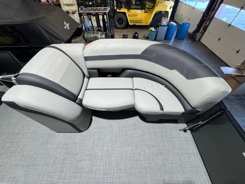 Slide: The Image of Luxurious seating on 2025 Sylvan L3 DLZ pontoon boat, featuring sleek gray and black upholstery. - 3