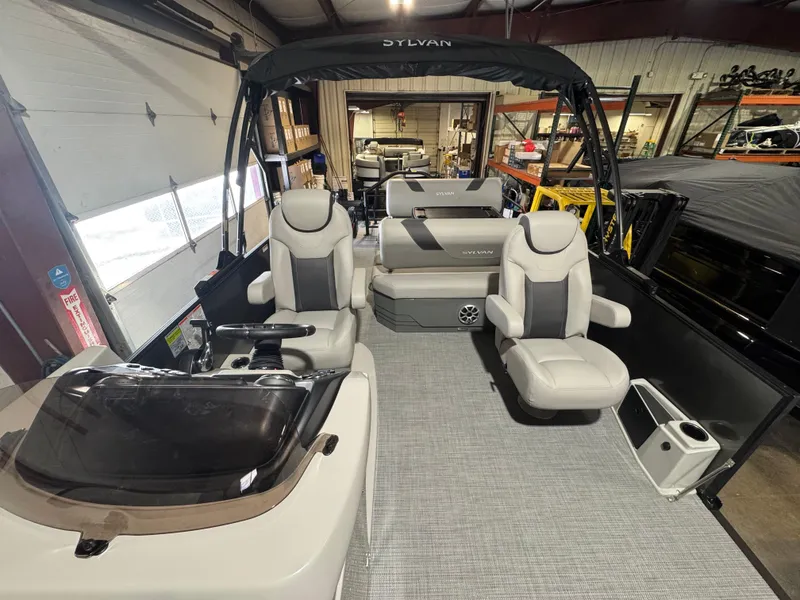 Slide: The Image of 2025 Sylvan L3 DLZ pontoon boat interior with plush seating and modern design. - 4