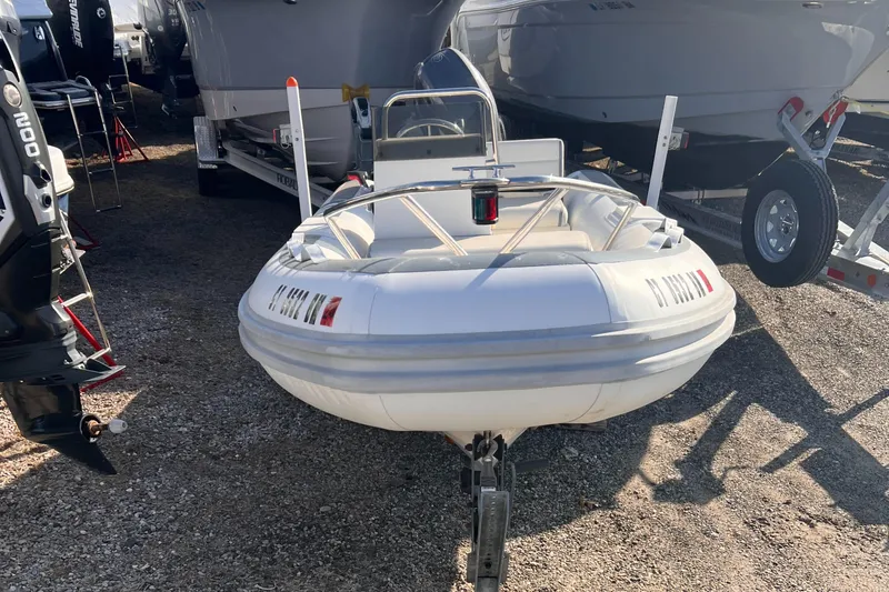 Slide: The Image of 2020 Novurania DL 400 inflatable boat on trailer, parked outdoors. - 10