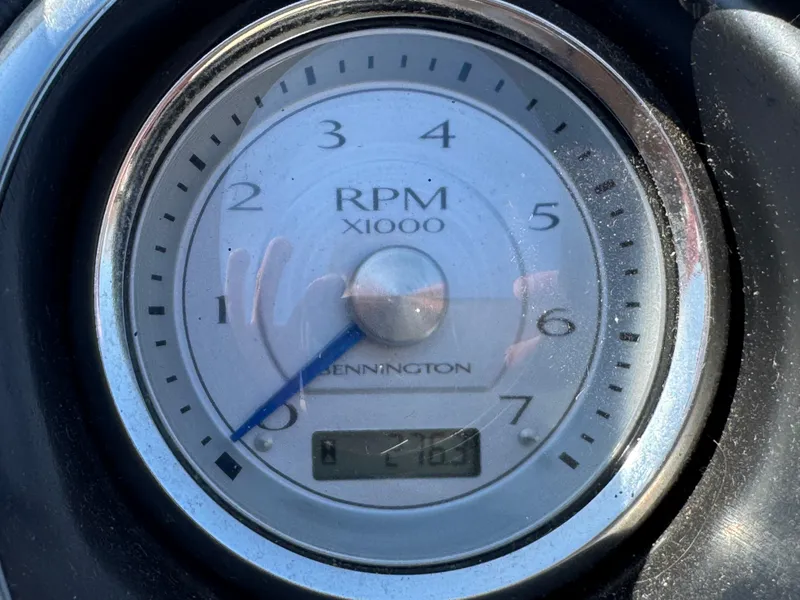 Slide: The Image of Close-up of a 2016 Bennington 2275 RCW RPM gauge displaying 2163 RPM. - 14