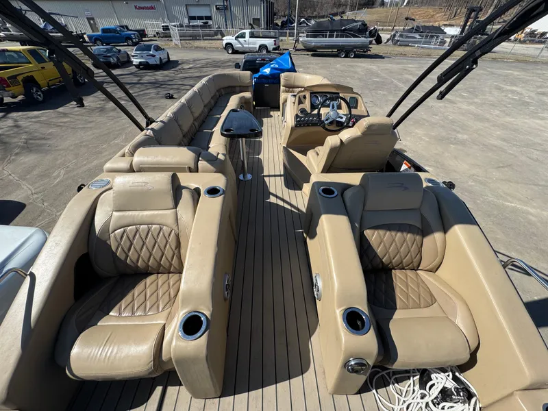 Slide: The Image of 2016 Bennington 2275 RCW pontoon boat with luxurious tan seating and modern design. - 15