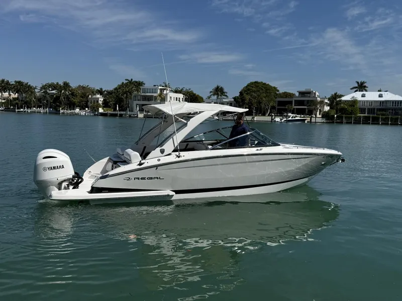 The Image of 2019 Regal 29 OBX boat on calm water with Yamaha outboard motor. - 0