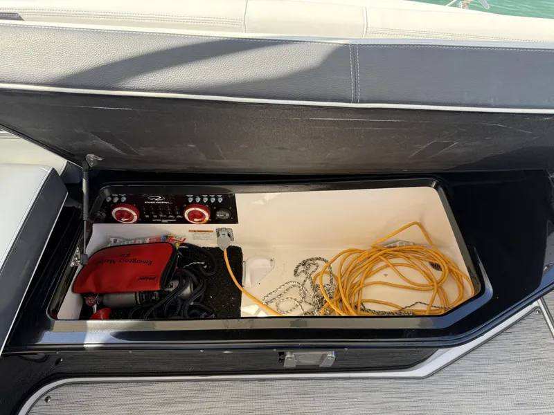 Slide: The Image of Storage compartment of 2019 Regal 29 OBX boat with cables and equipment. - 31