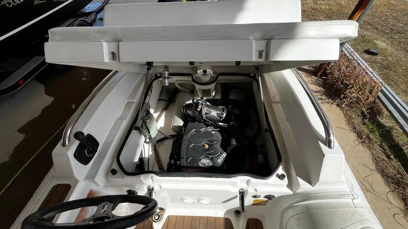 Slide: The Image of 2021 AB Inflatables ABJET 430XP engine compartment with open hatch, showcasing internal components. - 14