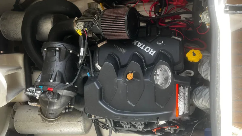 Slide: The Image of Engine compartment of a 2021 AB Inflatables ABJET 430XP with visible Rotax engine components. - 15