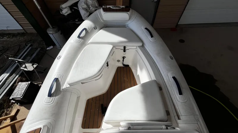 Slide: The Image of AB Inflatables ABJET 430XP 2021 model, white interior, wooden floor, docked indoors. - 9