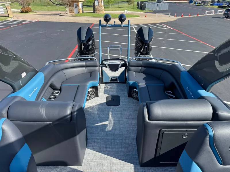 Slide: The Image of 2024 South Bay 25 Sport RS9-DC boat interior with blue and black seating. - 5