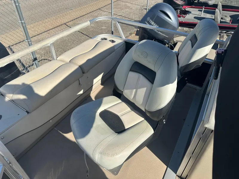 Slide: The Image of 2012 Sun Tracker Fishin' Barge 24 DLX interior with seating and Yamaha motor. - 12