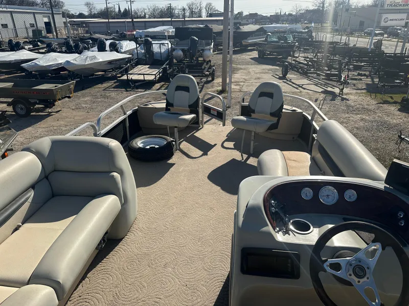 Slide: The Image of 2012 Sun Tracker Fishin' Barge 24 DLX pontoon boat with spacious seating and steering console. - 15