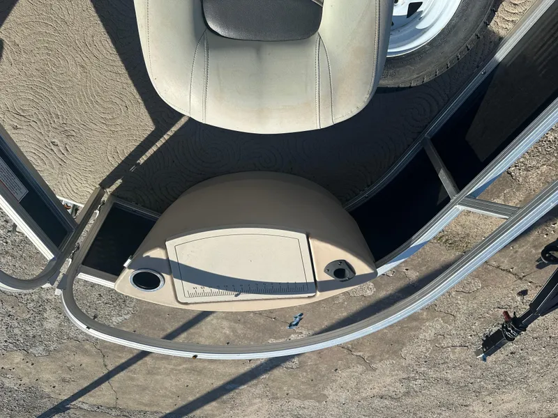 Slide: The Image of 2012 Sun Tracker Fishin' Barge 24 DLX deck view with seating and railing. - 17