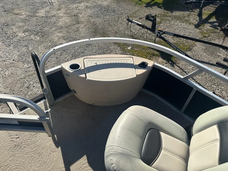 Slide: The Image of 2012 Sun Tracker Fishin' Barge 24 DLX boat interior with seating and storage. - 18