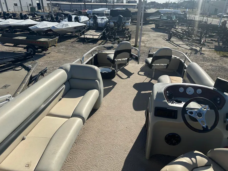 Slide: The Image of 2012 Sun Tracker Fishin' Barge 24 DLX pontoon boat with spacious seating and steering console. - 20