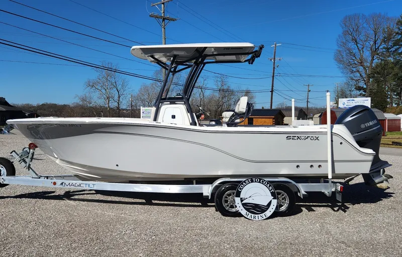 Slide: The Image of 2021 Sea Fox 248 Commander boat on trailer, side view, outdoors. - 1