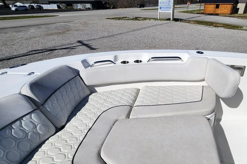 Slide: The Image of 2021 Sea Fox 248 Commander boat with cushioned seating and hexagonal pattern design. - 14