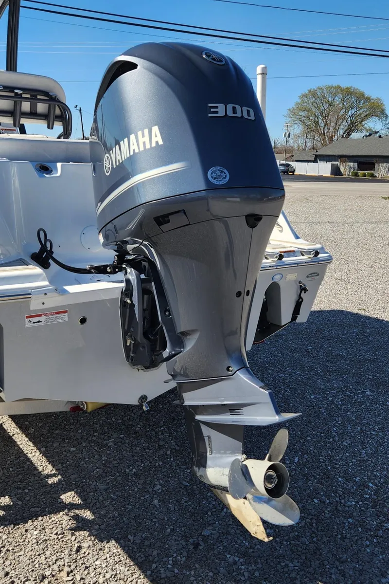 Slide: The Image of 2021 Sea Fox 248 Commander with Yamaha 300 outboard motor, parked on gravel. - 16