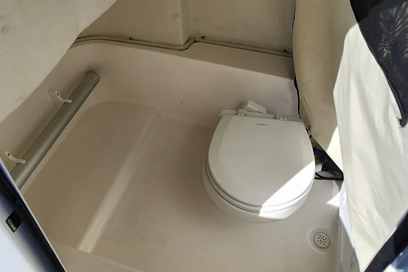 Slide: The Image of 2021 Sea Fox 248 Commander boat interior with compact marine toilet. - 18