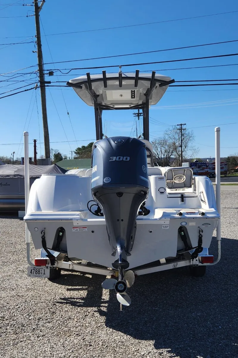 Slide: The Image of 2021 Sea Fox 248 Commander boat with powerful outboard motor, parked on gravel. - 3