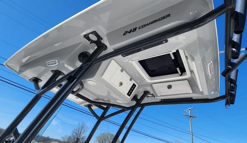 Slide: The Image of 2021 Sea Fox 248 Commander boat roof with storage compartments and blue sky background. - 4
