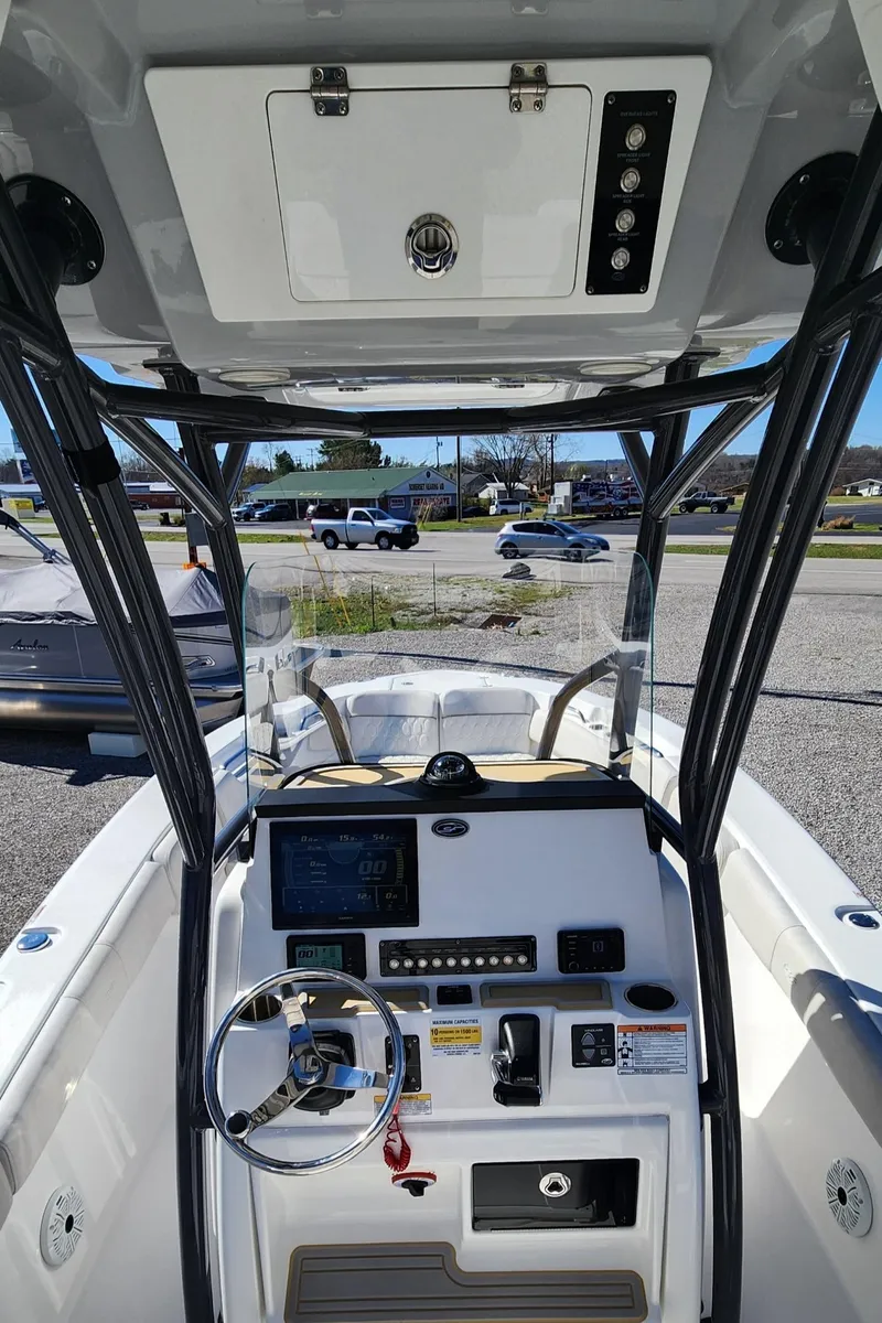 Slide: The Image of 2021 Sea Fox 248 Commander boat dashboard with steering wheel and control panel. - 8