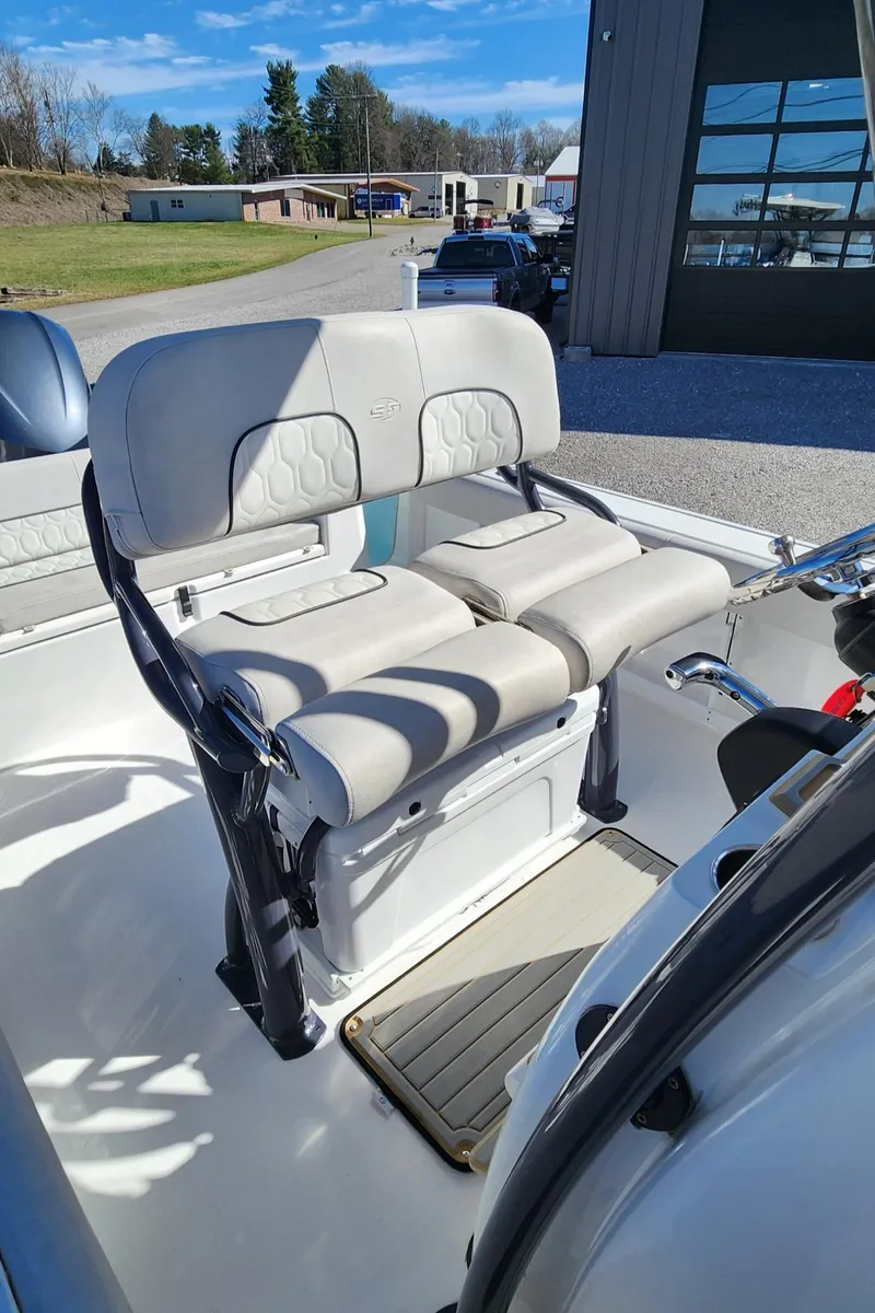 Slide: The Image of 2021 Sea Fox 248 Commander boat interior with cushioned seating and storage. - 9