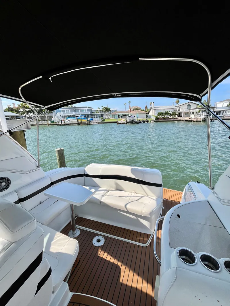 Slide: The Image of 2012 Formula 31 PC yacht interior with seating, table, and waterfront view. - 16