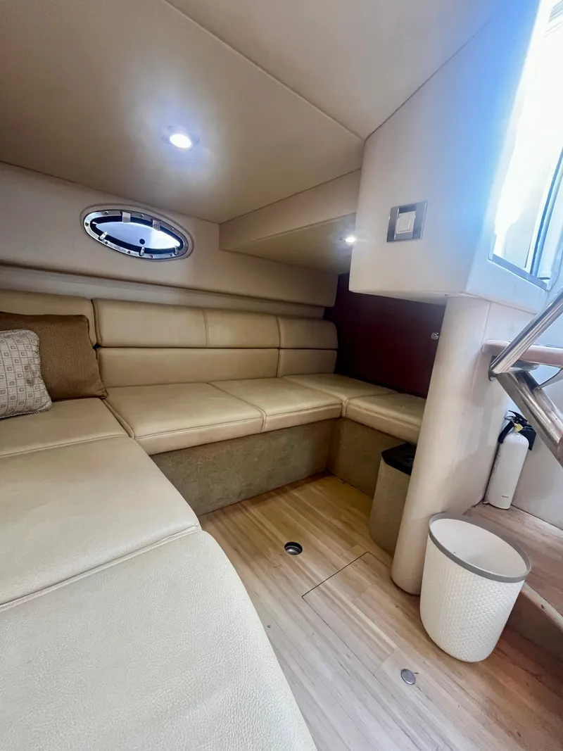 Slide: The Image of 2012 Formula 31 PC cabin interior with beige seating and modern lighting. - 21