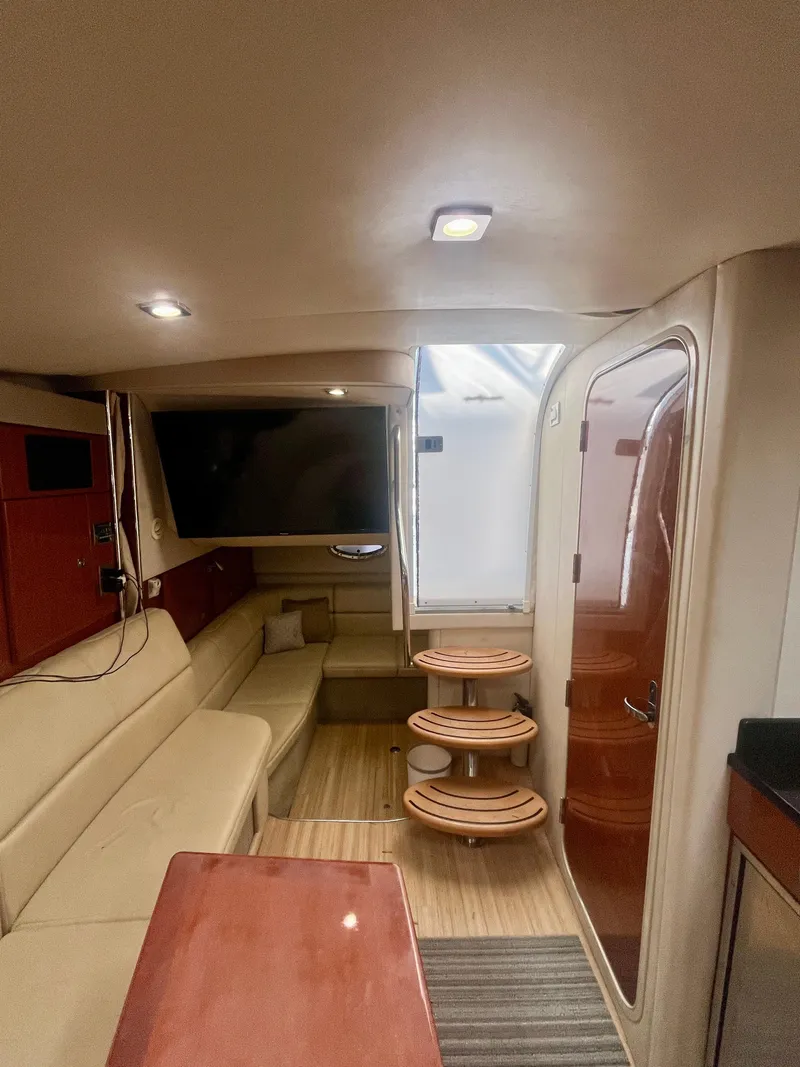 Slide: The Image of Interior of 2012 Formula 31 PC yacht with beige seating and wooden accents. - 23