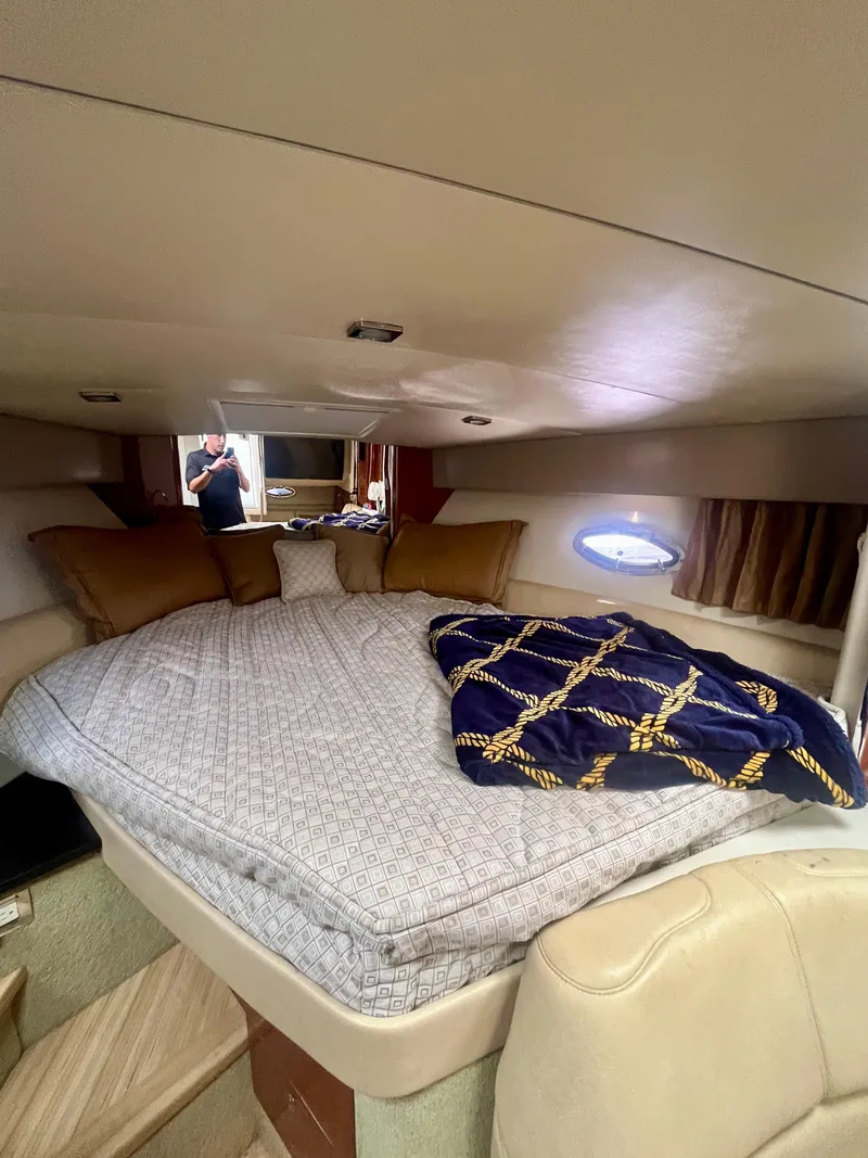 Slide: The Image of 2012 Formula 31 PC cabin interior with cozy bed and porthole view. - 25