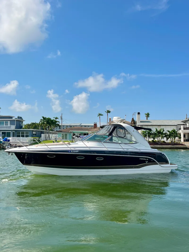 Slide: The Image of 2012 Formula 31 PC boat on calm water with clear blue sky. - 3