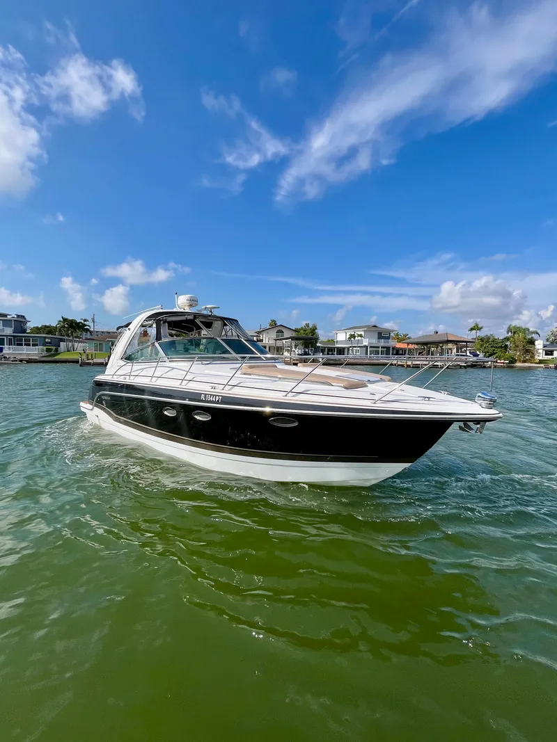 Slide: The Image of 2012 Formula 31 PC boat cruising on a sunny day with clear blue skies. - 5