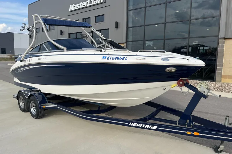 Slide: The Image of Azure AZ238 boat on trailer, parked outside MasterCraft building, 2013 model. - 1