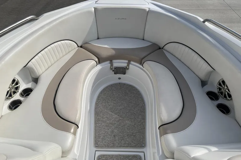 Slide: The Image of Luxurious seating area of 2013 Azure AZ238 boat with plush cushions and cup holders. - 11
