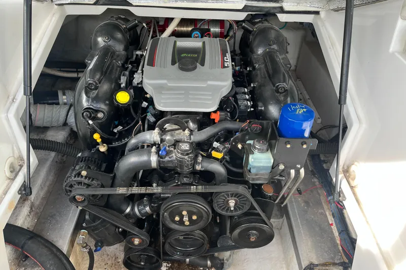 Slide: The Image of Engine compartment of a 2013 Azure AZ238 boat, showcasing detailed mechanical components. - 13