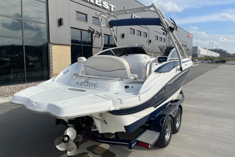 Slide: The Image of 2013 Azure AZ238 boat on trailer, parked outside a commercial building. - 3