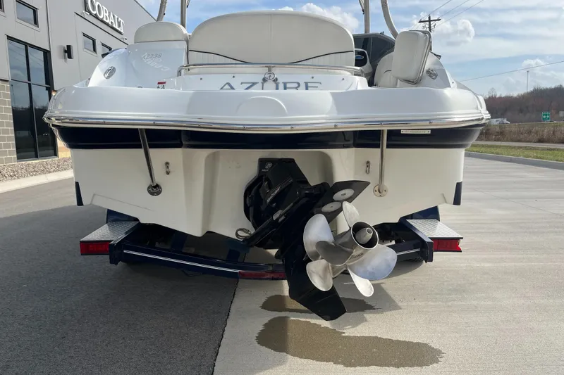Slide: The Image of Rear view of a 2013 Azure AZ238 boat with dual propellers on a trailer. - 7