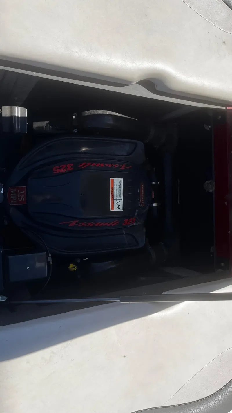 Slide: The Image of 2007 Supra Sunsport 22 V engine compartment with visible engine components. - 10