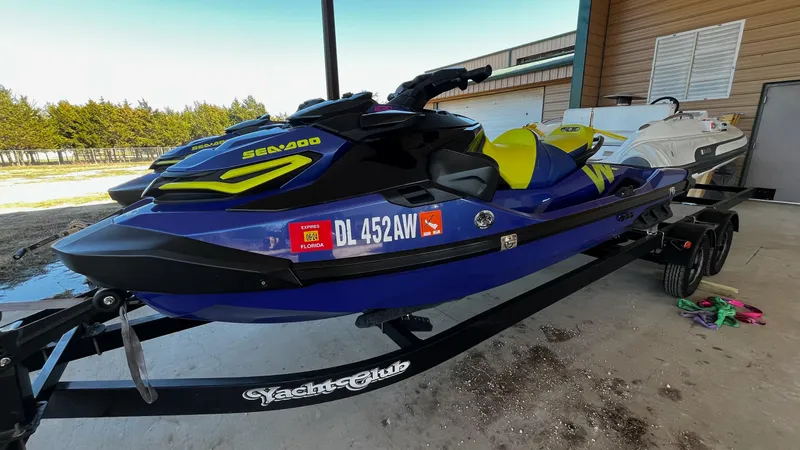 Slide: The Image of 2021 Sea-Doo Wake Pro 230 jet ski on trailer, parked outdoors. - 3