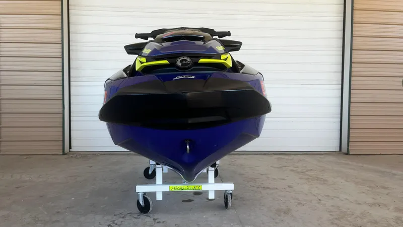 Slide: The Image of 2021 Sea-Doo Wake Pro 230 jet ski in a garage, front view. - 5